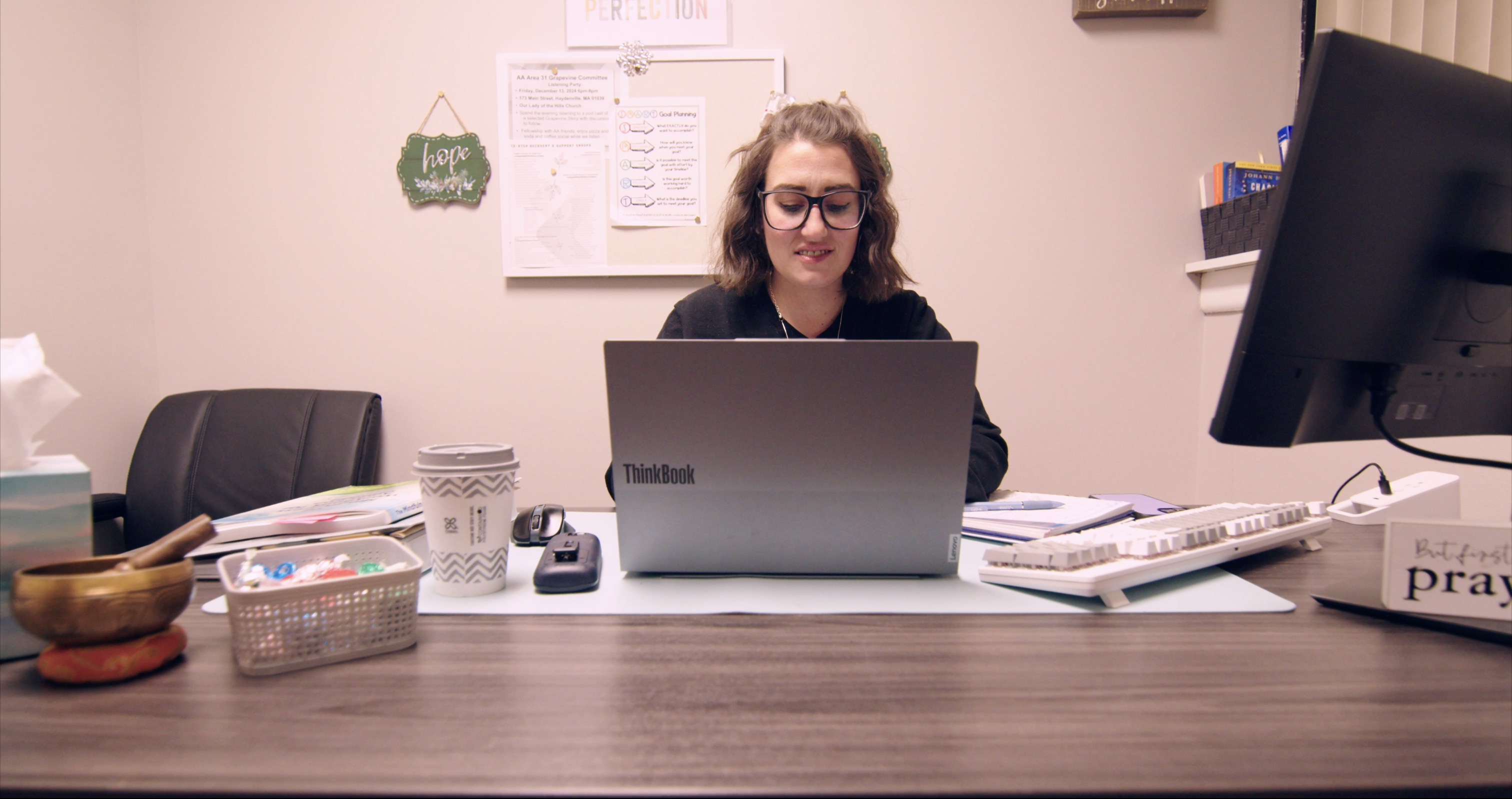 Woman studying at a desk.