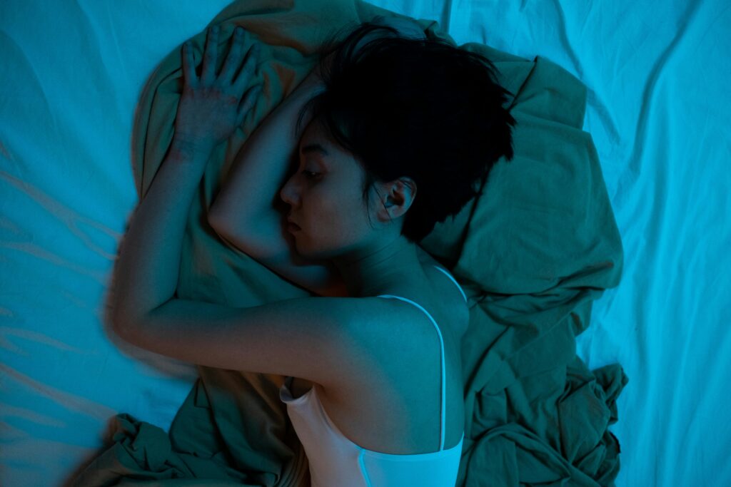 A woman laying in bed.