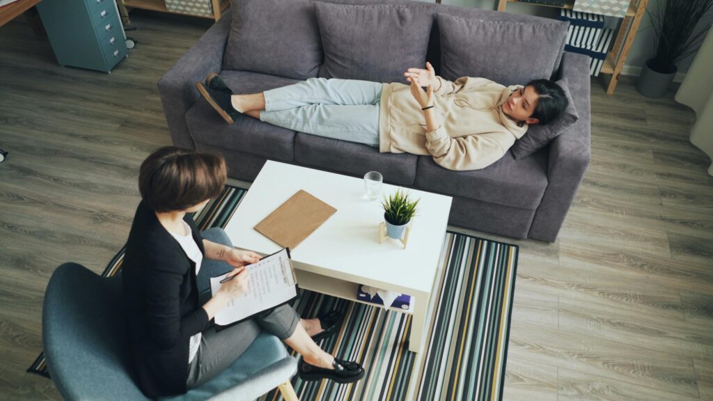 A woman with repressed trauma in a therapy session.